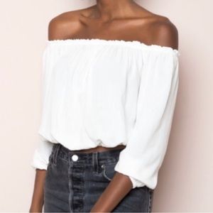 Brandy Melville “Maura” cropped white off shoulder top